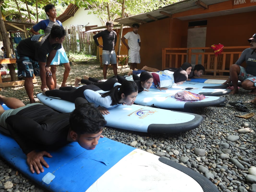 Cimaja Surf Lesson instructor guiding a student on the waves